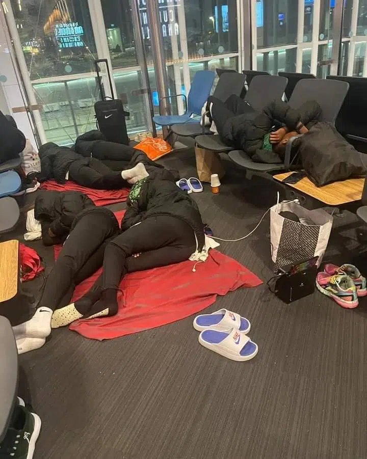 Nigerian Falconets Sleep on Cold Airport Floor after being left stranded [photos]