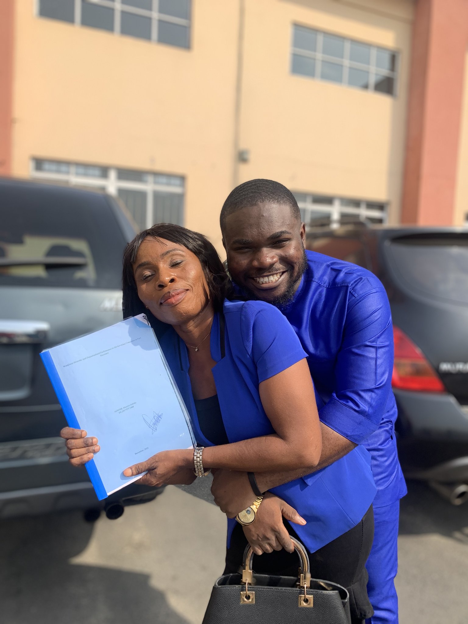 Man celebrates mom as she graduates 20 years after dropping out to send him to school [photos]