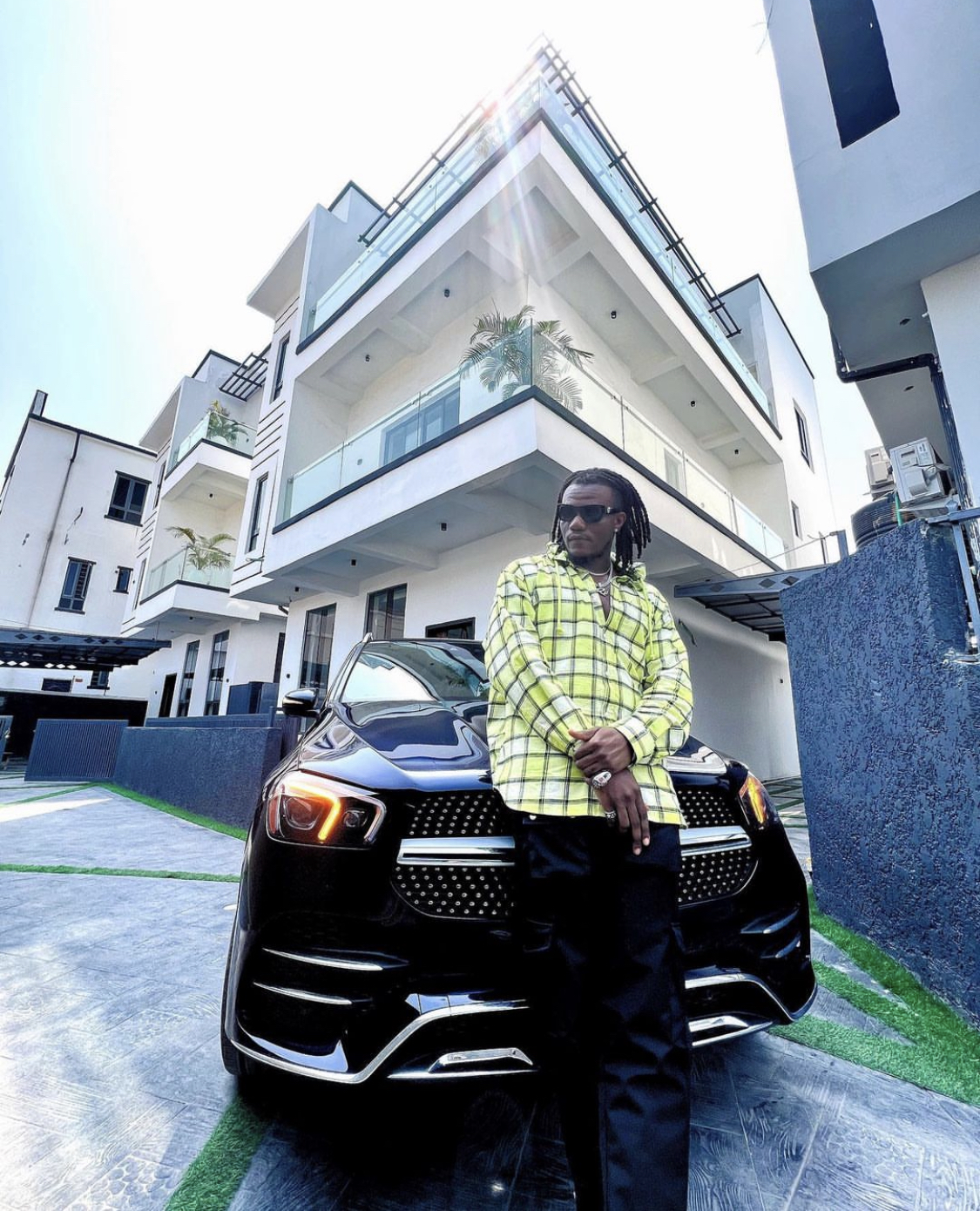 Singer Pheelz splashes millions on new car and house [photos]