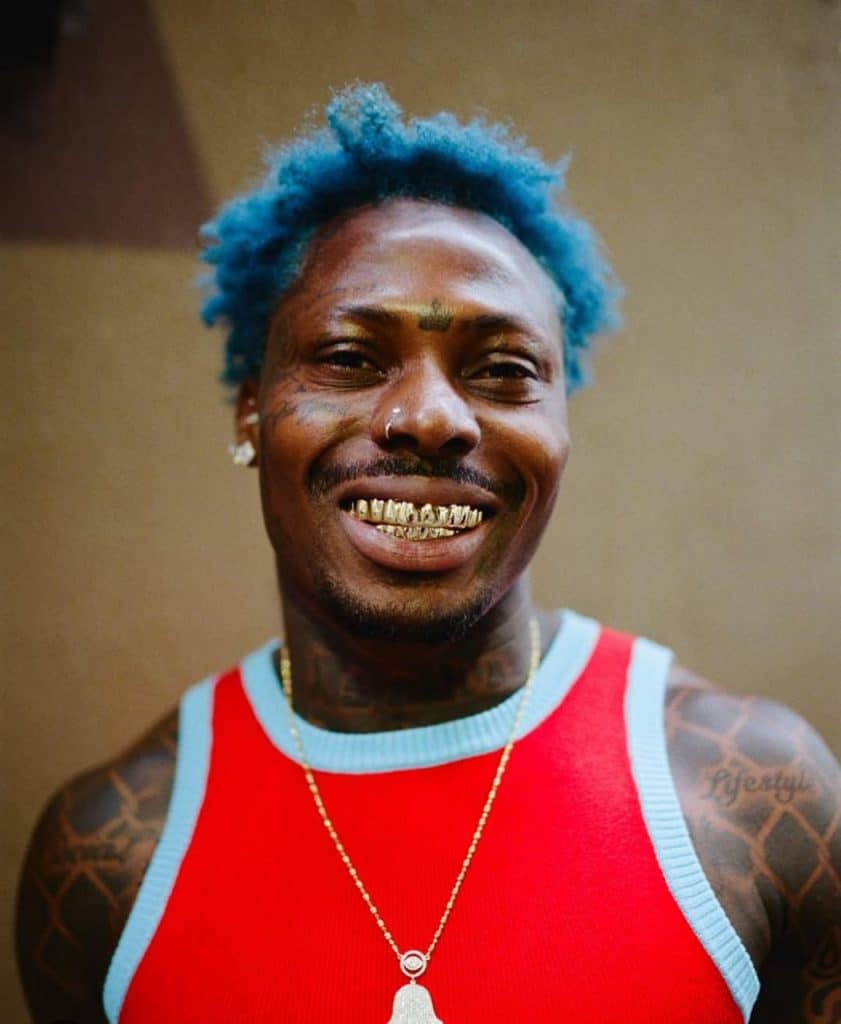 a picture of asake smiling