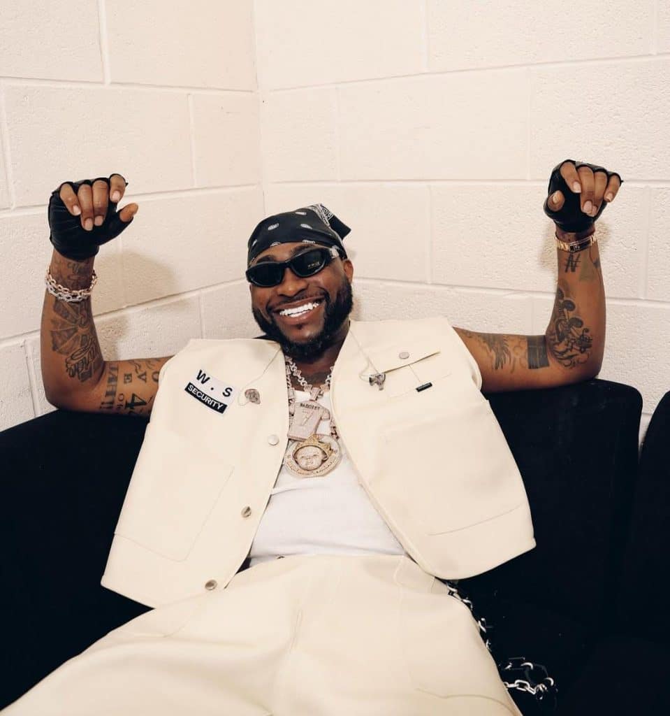 a picture of davido smiling - davido net worth 2025