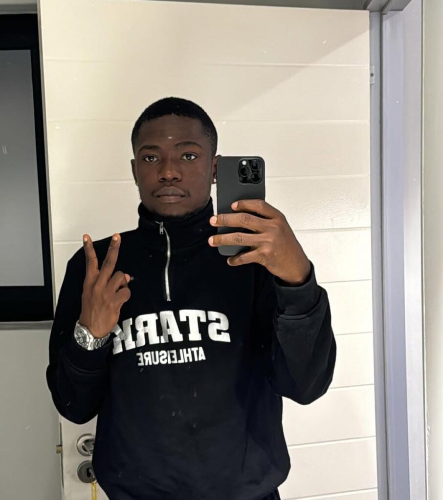 a picture of shank comic in front of a mirror