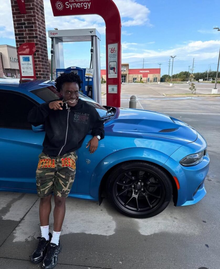 Suburb Baby Biography, Age, Real Name, Origin, Height, Net Worth (2025) 3 A picture of suburbbaby posing in from of his blue hellcat Daytona